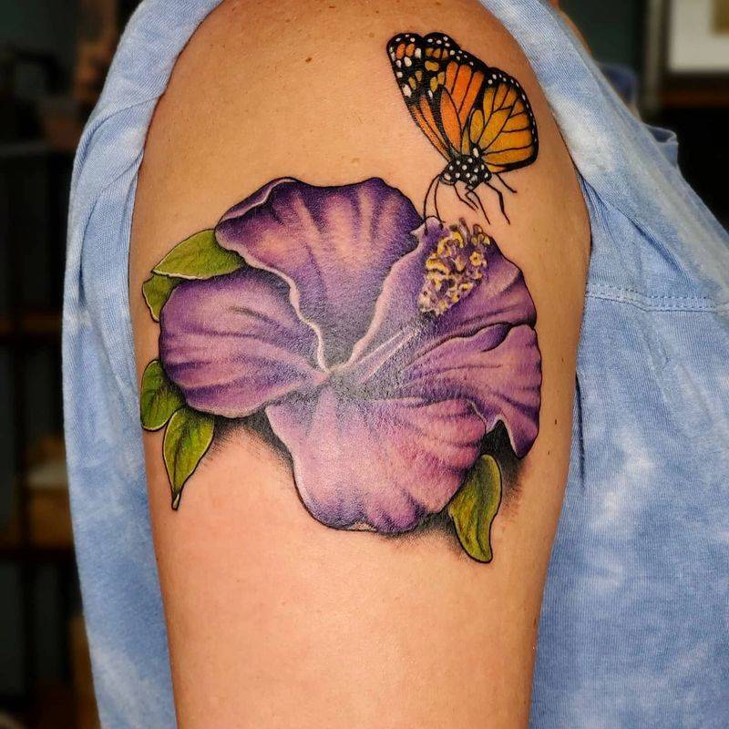 flower and butterfly tattoo by custom tattoo artist at Watford city